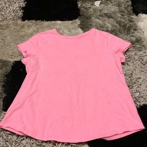 A pink shirt size XL